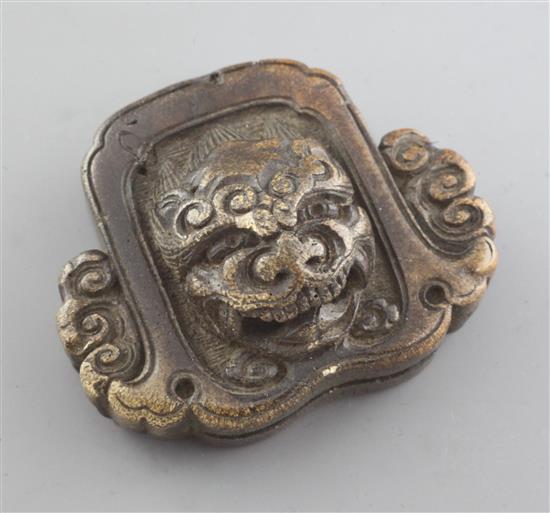 A Japanese stag antler netsuke of a roof tile with head of shishi, mid 19th century, w. 4.3cm
